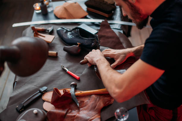 istock difficult work of a shoemaker, the trade of shoemaker 1242743022