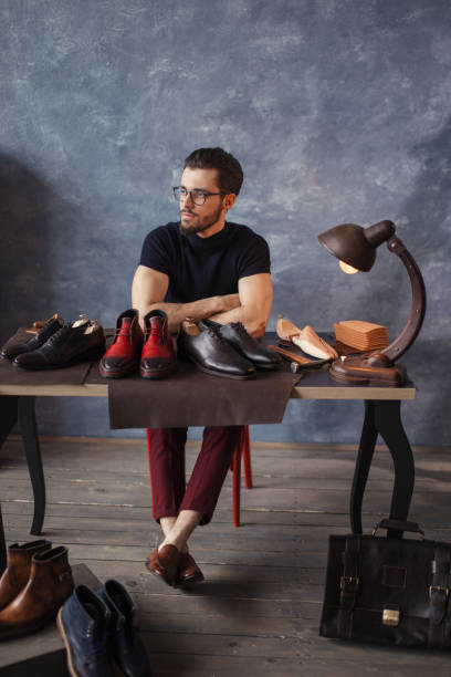 istock pensive good looking shoeshine man resting after working day 1242748852