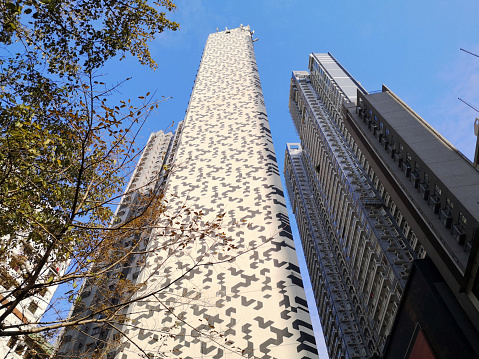 Low angle view of the modern high rise apartment buildings in Sheung Wan, hong Kong.