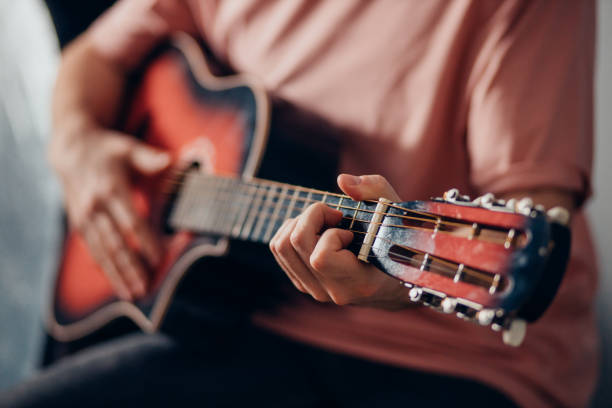 istock closeup of unrecognizable man playing the guitar 1242798794