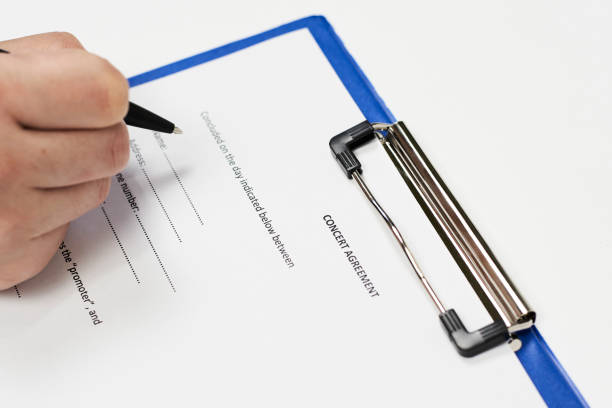 istock Signing concert agreement 1242805635