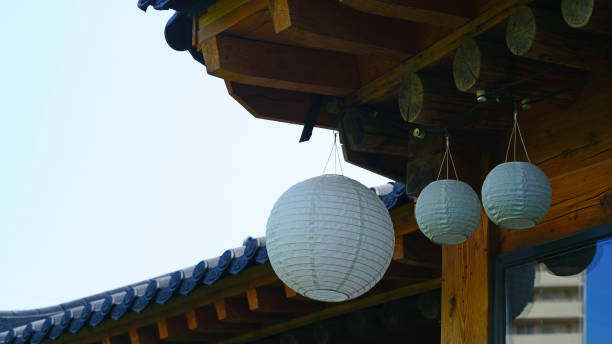 istock 3 white lanterns on the roof eaves 1242829090