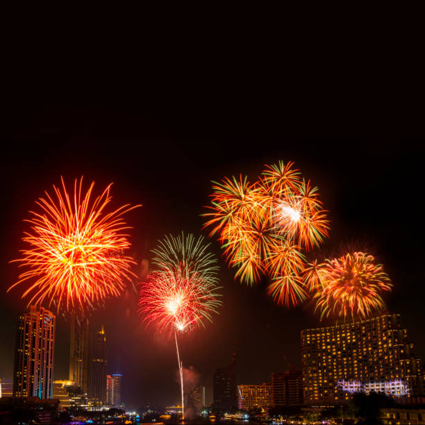 istock Beautiful firework display for celebration happy new year and merry christmas with  Twilight night and firework lighting in bangkok cityscape background, Thailand. 1242851103