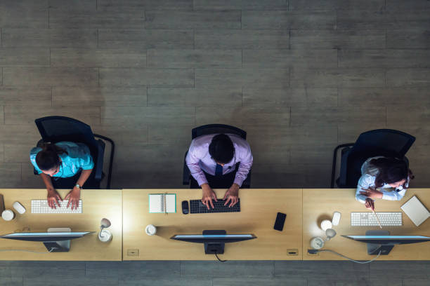 Top view of Asian Male customer care service working hard late in night shift at office stock photo