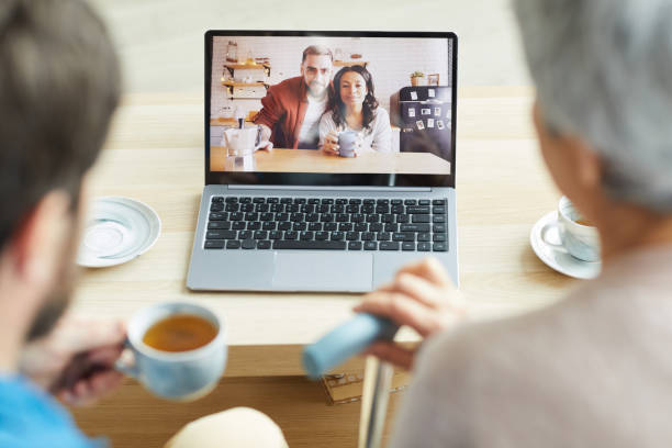istock Young couple talking with family 1242877801