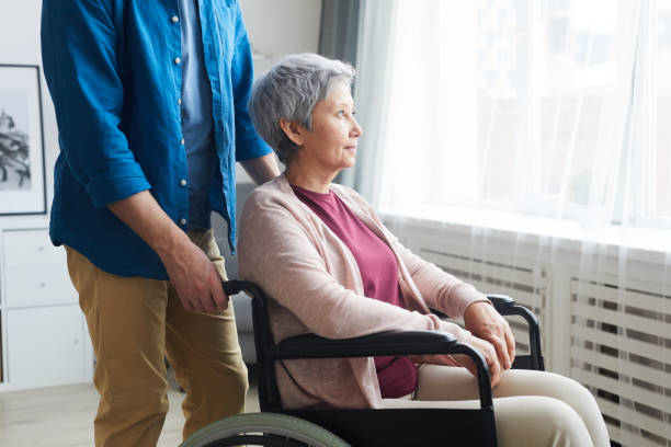 istock Disabled woman in wheelchair 1242879463