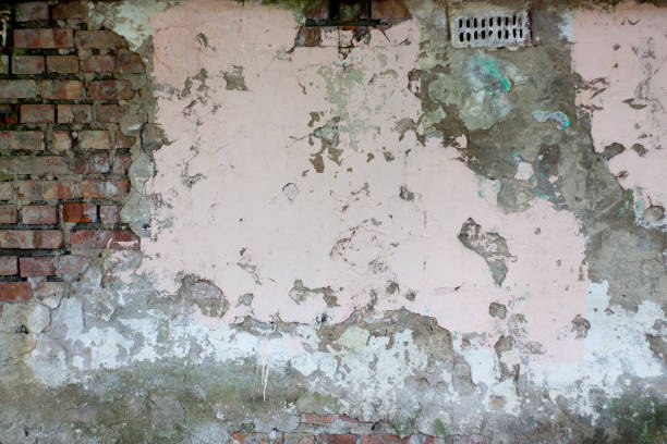 istock old brick wall, texture with cracked and fallen plaster. 1242883550