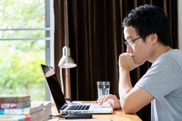 istock Asian man working at home 1242889053