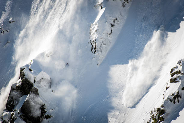 Snowboarder, Skier caught in the snow avalanche Snowboarder, Skier caught in the snow avalanche avalanche stock pictures, royalty-free photos & images