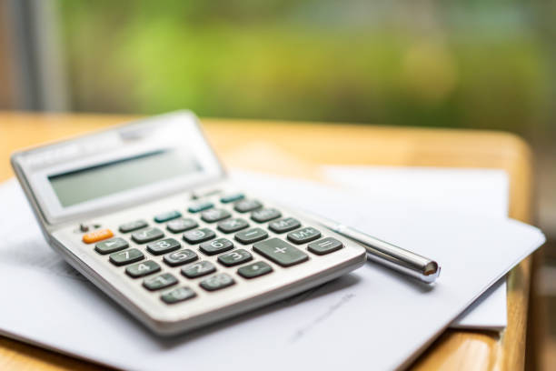 basic calculator on the table - calculator imagens e fotografias de stock