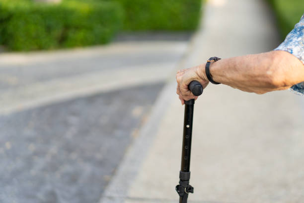 istock Elder woman walking 1242890112