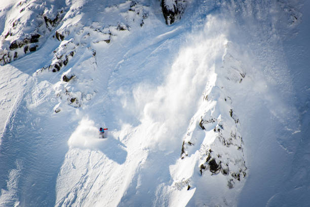 Snowboarder, Skier caught in the snow avalanche Snowboarder, Skier caught in the snow avalanche avalanche stock pictures, royalty-free photos & images