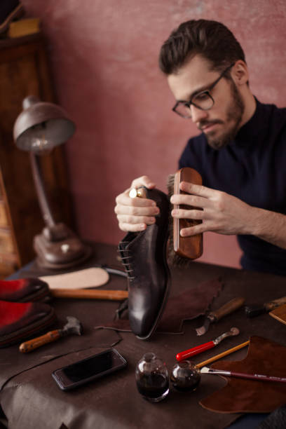 istock awesome shoeshine man working at home 1242893914