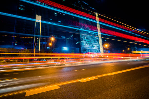 istock Vehicle light trails in city at night 1242898373