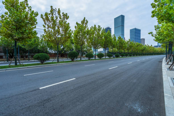 istock city empty traffic road with cityscape in background 1242898910
