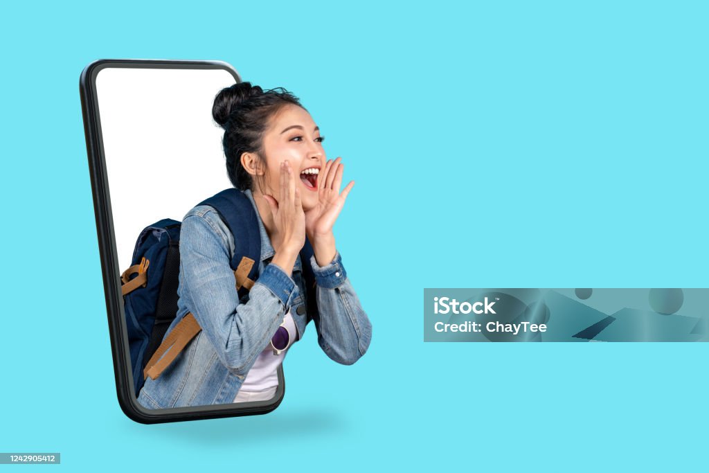 Smartphone pop up for advertising.Asian woman travel backpacker shouting open mouth through from screen mobile.Girl looking to aside copy space for present promotions.Digital marketing online cencept. Marketing Stock Photo