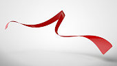 Red curled ribbon on white background