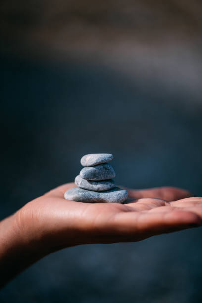 istock Woman Holding Zen Stones 1242932804