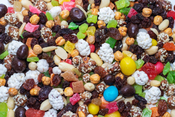 istock Mix nuts and dry fruits on a white background 1242945411