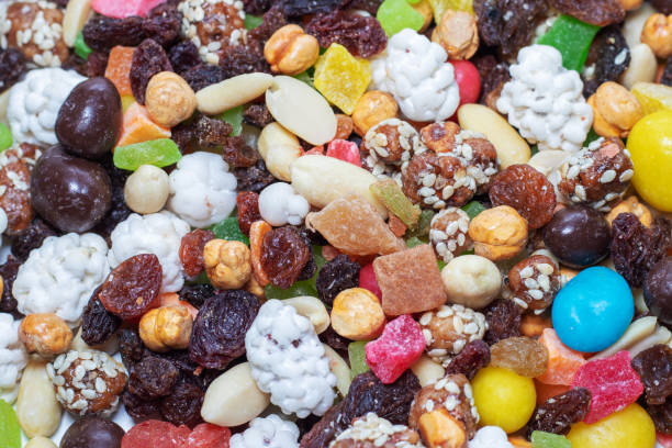 istock Mix nuts and dry fruits on a white background 1242945938