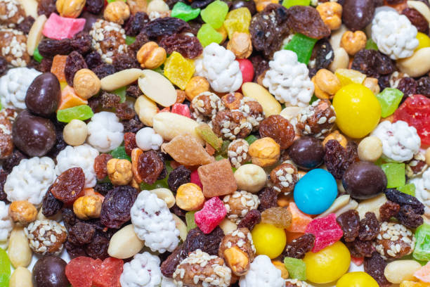 istock Mix nuts and dry fruits on a white background 1242946404
