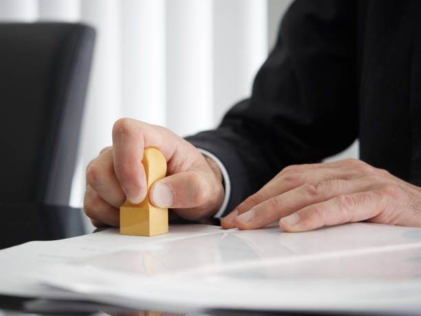 japanese judicial scrivener's hand stamping the horn - seal a deal imagens e fotografias de stock