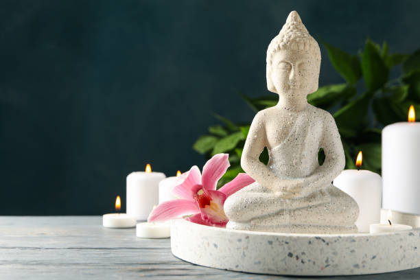 istock Composition with buddha and candles on wooden table. Zen concept 1242952438