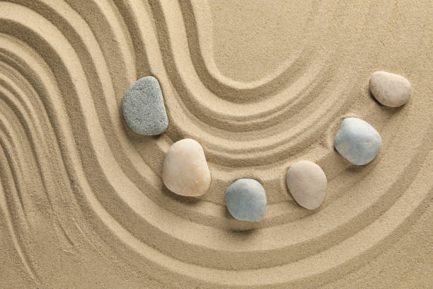 istock Stones on the sand with patterns. Zen concept 1242956153