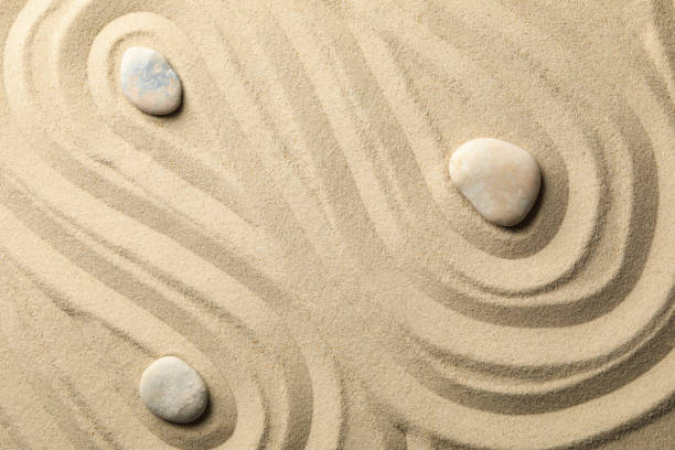 istock Stones on the sand with patterns. Zen concept 1242958293