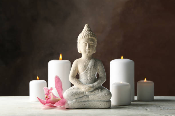 istock Composition with buddha and candles on wooden table. Zen concept 1242960466
