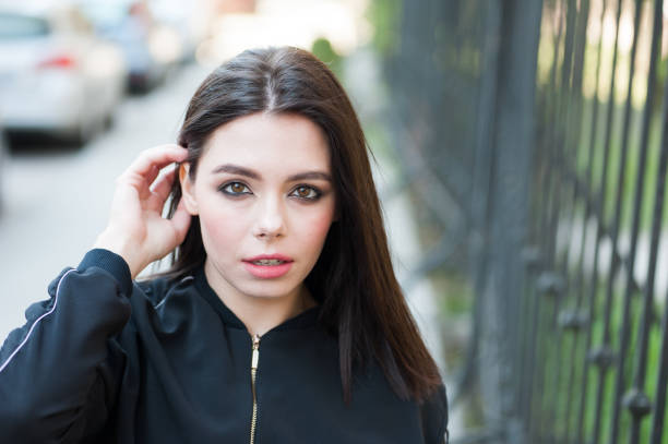 Young beautiful woman in windy weather
