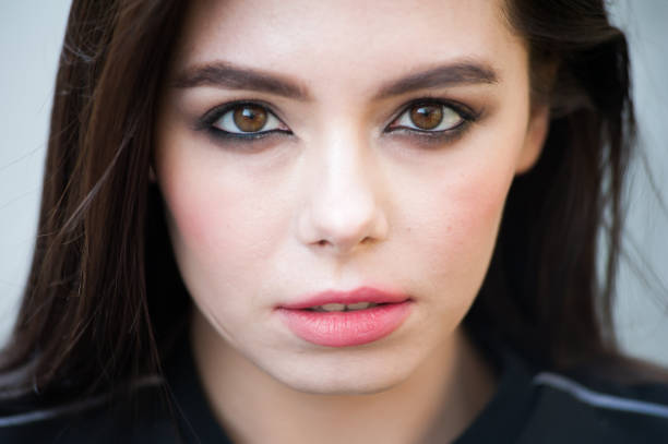 istock Young beautiful woman in windy weather 1242977070