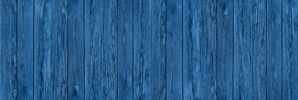 istock old blue wooden fence with peeling paint 1242980905