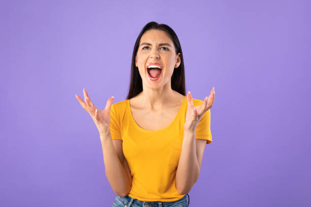 istock Angry young female grimacing, screaming and feeling furious 1242981435