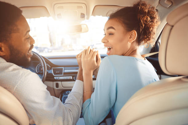 istock Black Couple Holding Hands Celebrating Buying New Auto 1242982014