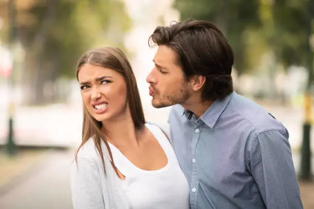Photo of Girl Rejecting To Kiss Guy On Unsuccessful Date Walking Outside