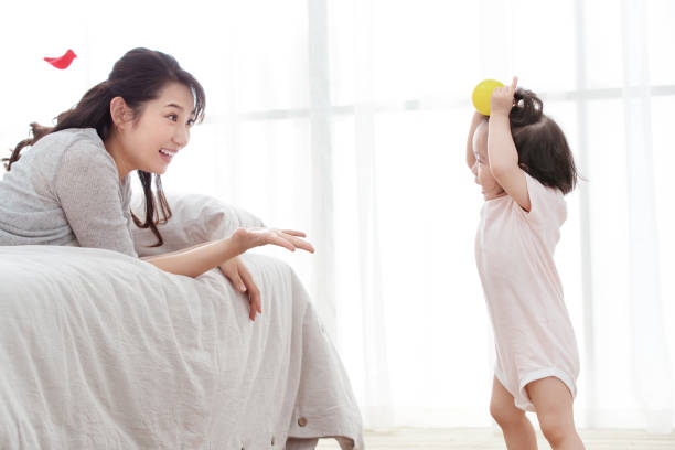 istock Happy mother and daughter play 1242987797