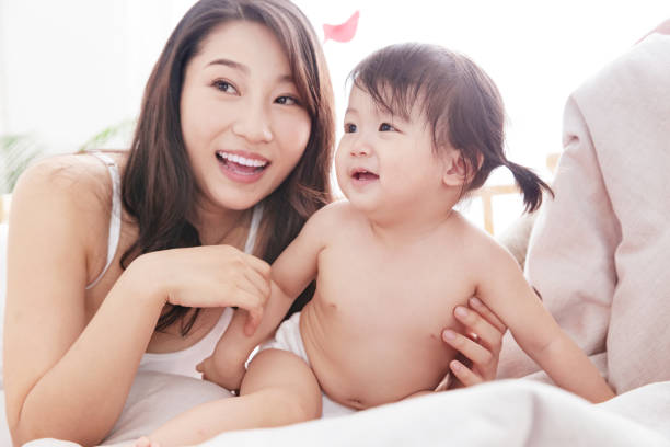 istock Happy mother and daughter play 1242988325