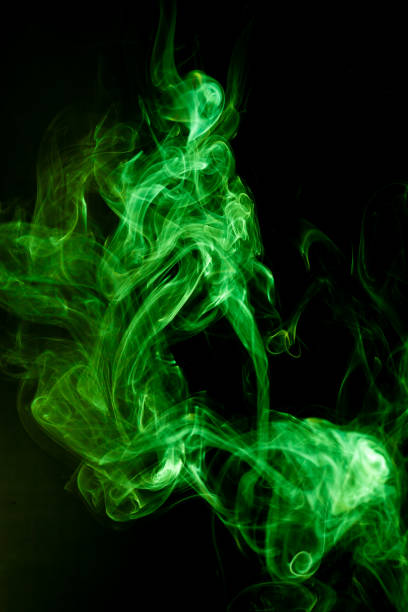 istock Green smoke motion on black background. 1242998088