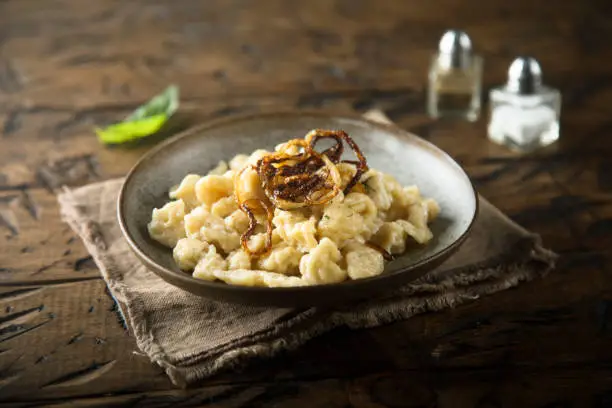 Traditional German noodles with cheese and fried onion