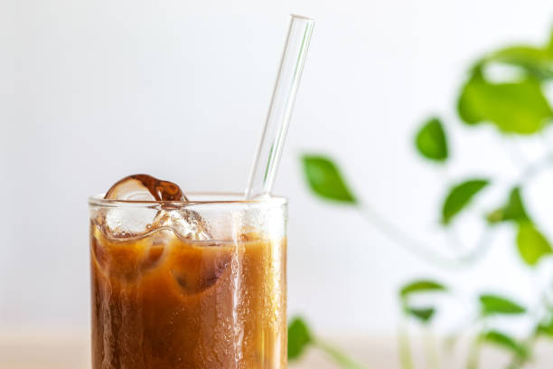 cold brew coffee with milk on white wooden table, Close up.