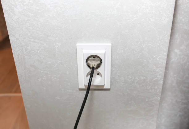 istock New sockets on the white wall. Details after renovation. Restoration process in the flat. 1243051659