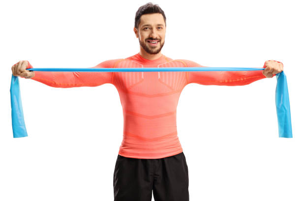 istock Man in sportswear stretching an elastic band 1243053303