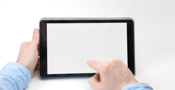 istock Male hands holding digital tablet blank screen horizontally on white background. Take your screen to put on advertising 1243053314