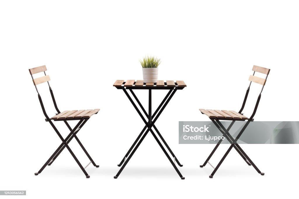 Studio shot of a wooden table with two chairs Studio shot of a wooden table with two chairs isolated on white background Table Stock Photo