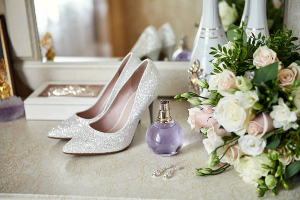 istock bridal accessories such as shoes, bouquet, ring and perfume on a table 1243058809