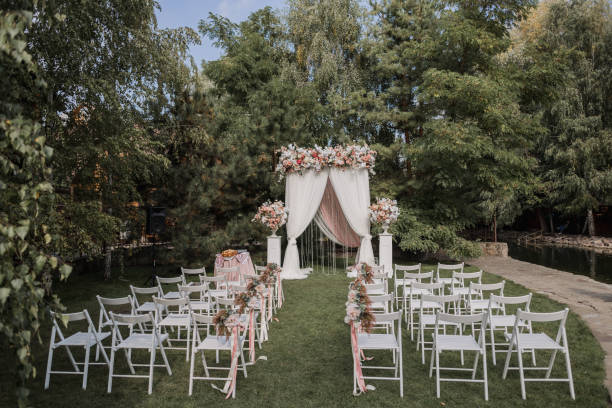 istock arch for a wedding ceremony with flowers in park 1243059347