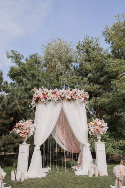 istock arch for a wedding ceremony with flowers in park 1243059360