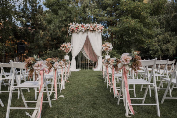 istock arch for a wedding ceremony with flowers in park 1243059866