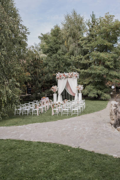 istock arch for a wedding ceremony with flowers in park 1243062629
